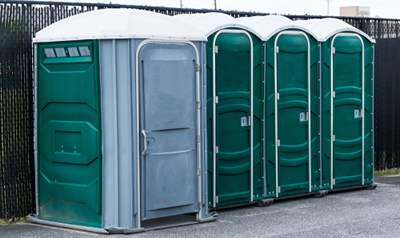 wheelchair accessible portable toilet at an outdoor event